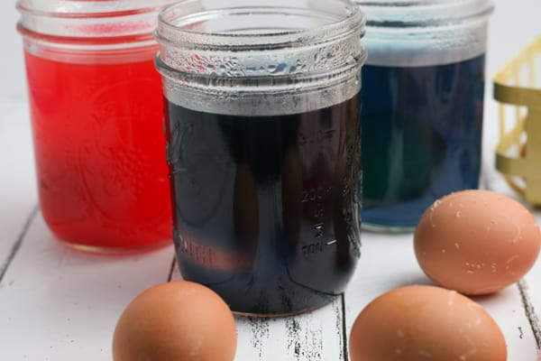 using food colouring to dye easter eggs decorated with wax crayons