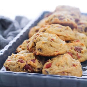cherry and pecan cookies on a grey baking tray