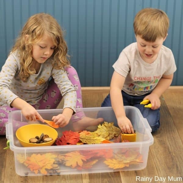 children playing together in the sensory bin