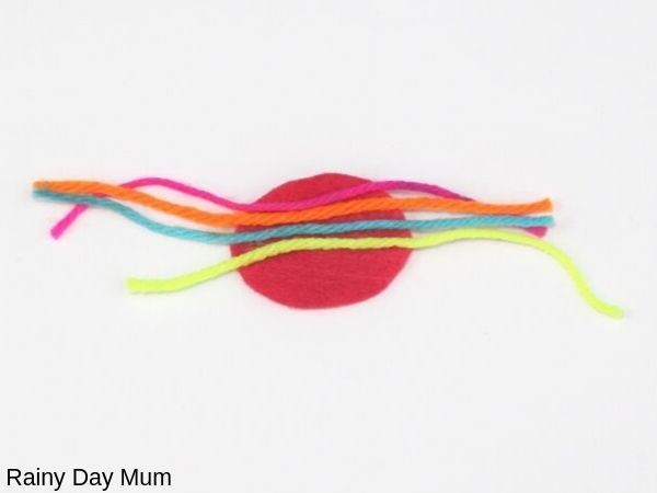step 1 in making a simple no sew incy wincy spider for nursery rhyme sensory tub play ideas