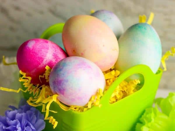 basket of marbled easter eggs you can make with toddlers and preschoolers