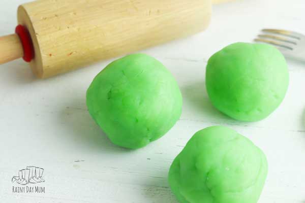 3 lime green playdough balls made with jell-o and a simple playdough recipe