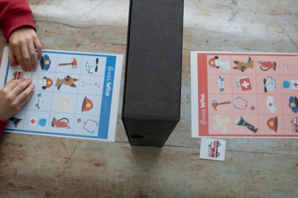 emergency worker printable guess who game being played by 2 kids