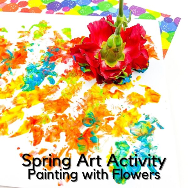 red carnation in paint on a piece of paper painted with bright craft paints created by a child with the flower