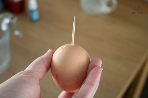 using a toothpick to blow the egg, the toothpick is inserted into the base of the egg and helps to break the membrane and mix the yolk and egg white together making it easier to blow