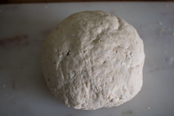 bread dough smooth after kneading on a granite worktop