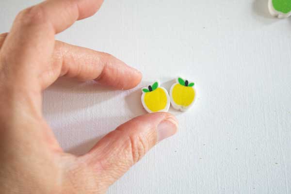 matching 2 yellow apple mini-erasers with preschoolers