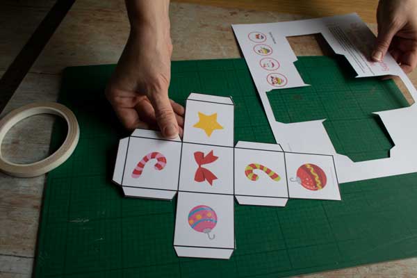 roll a cube dice net cut out from the game pieces for a printable board game for kids