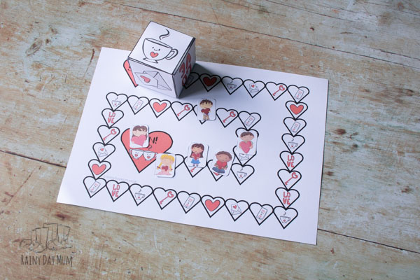 Valentine's Day Printable board game from Rainy Day Mum, printed and set up on the floor ready to play