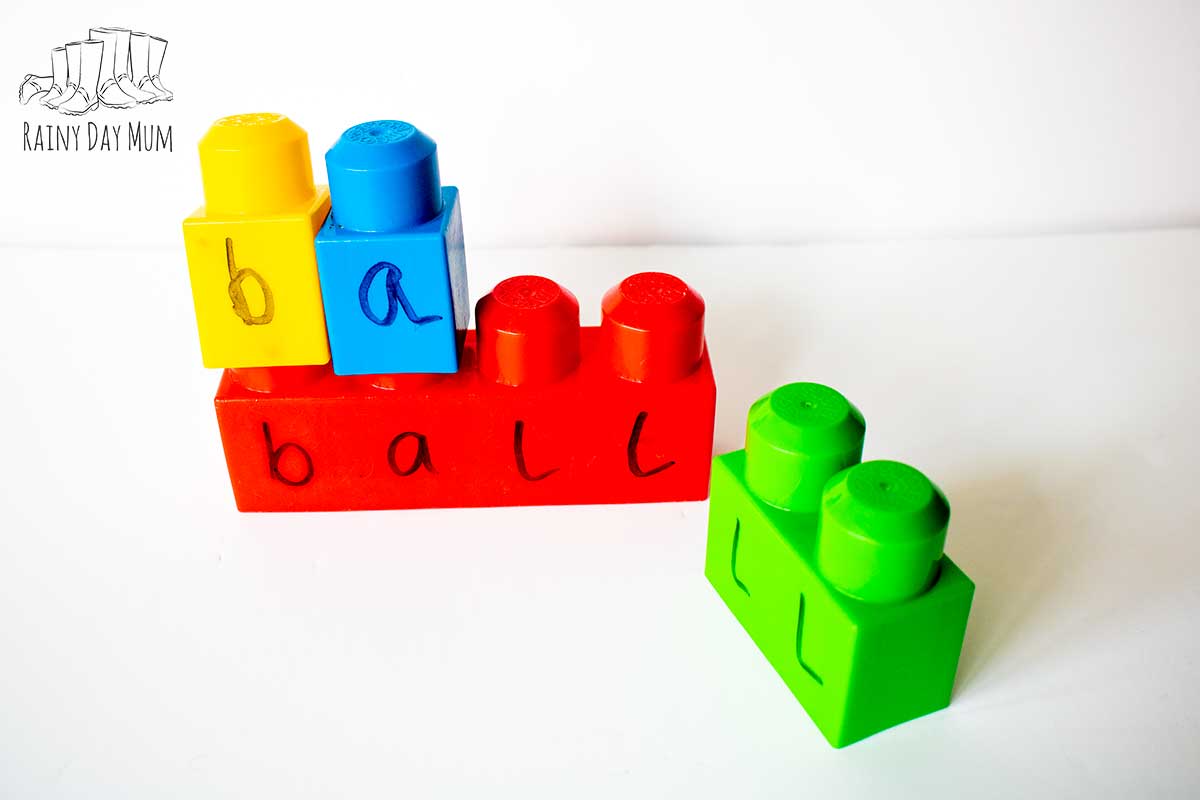 forming words of 4 letters with building blocks a 4 block has the word ball written on it and the blocks for b, a and ll are around.