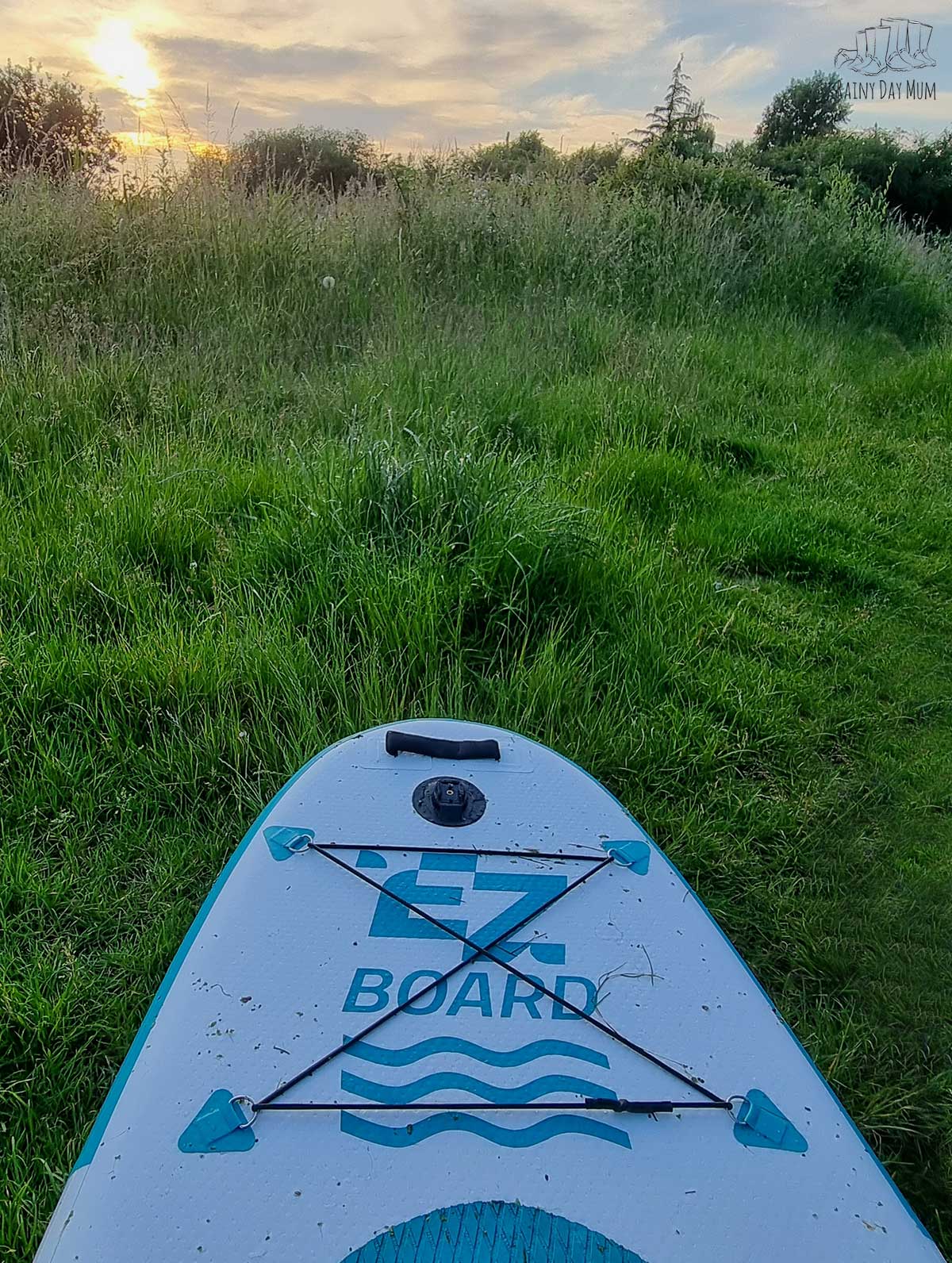 EZ Kids Paddleboard on the grass after a sunset paddle in the UK with the family.