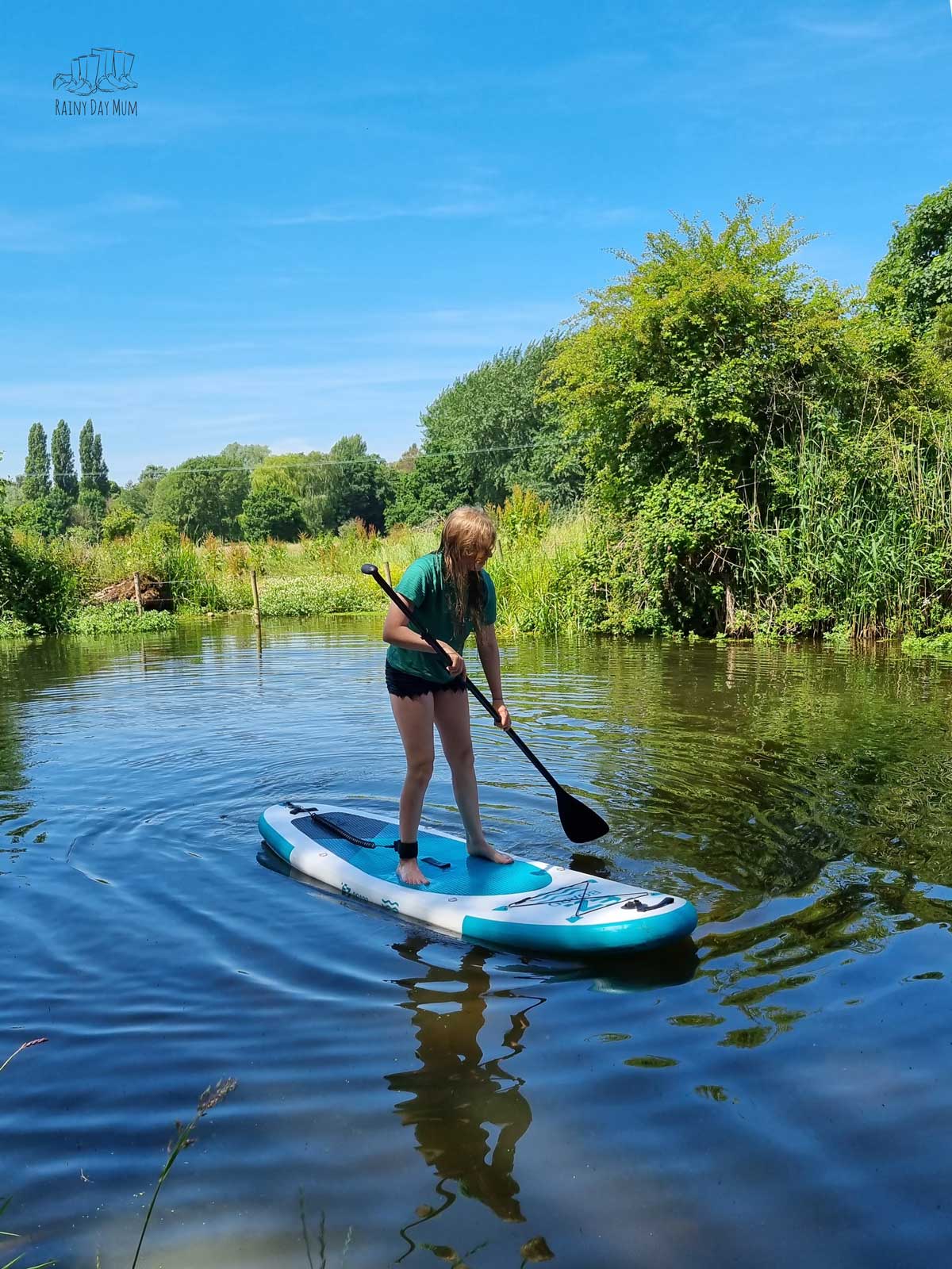 Girl on an EZ Kids Paddleboard in the Summer on a river